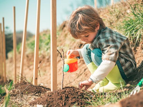 Child farmer planting